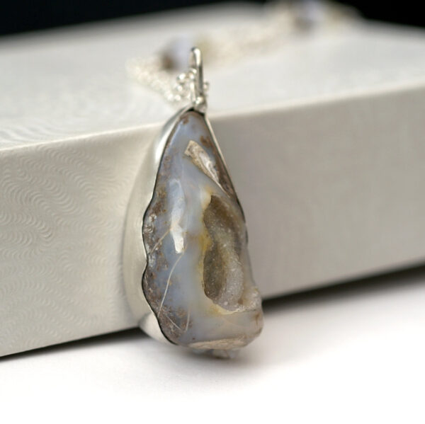 Sea Druzy: Sterling silver necklace with fossilized shell druzy. Adorned with blue lace agate, smoky quartz and lemon quartz beads.