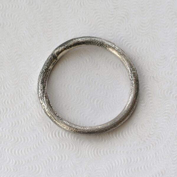 Rustic: Sterling silver band textured with reticulation (melting of the surface), round and comfortable, 2mm wide.